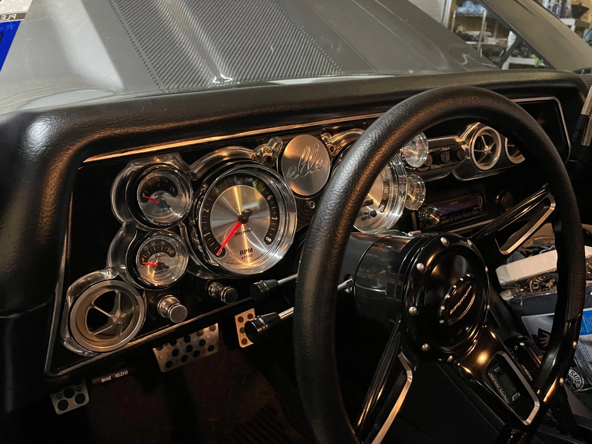 Chevelle dashboard, gauge cluster and steering wheel with the hood open