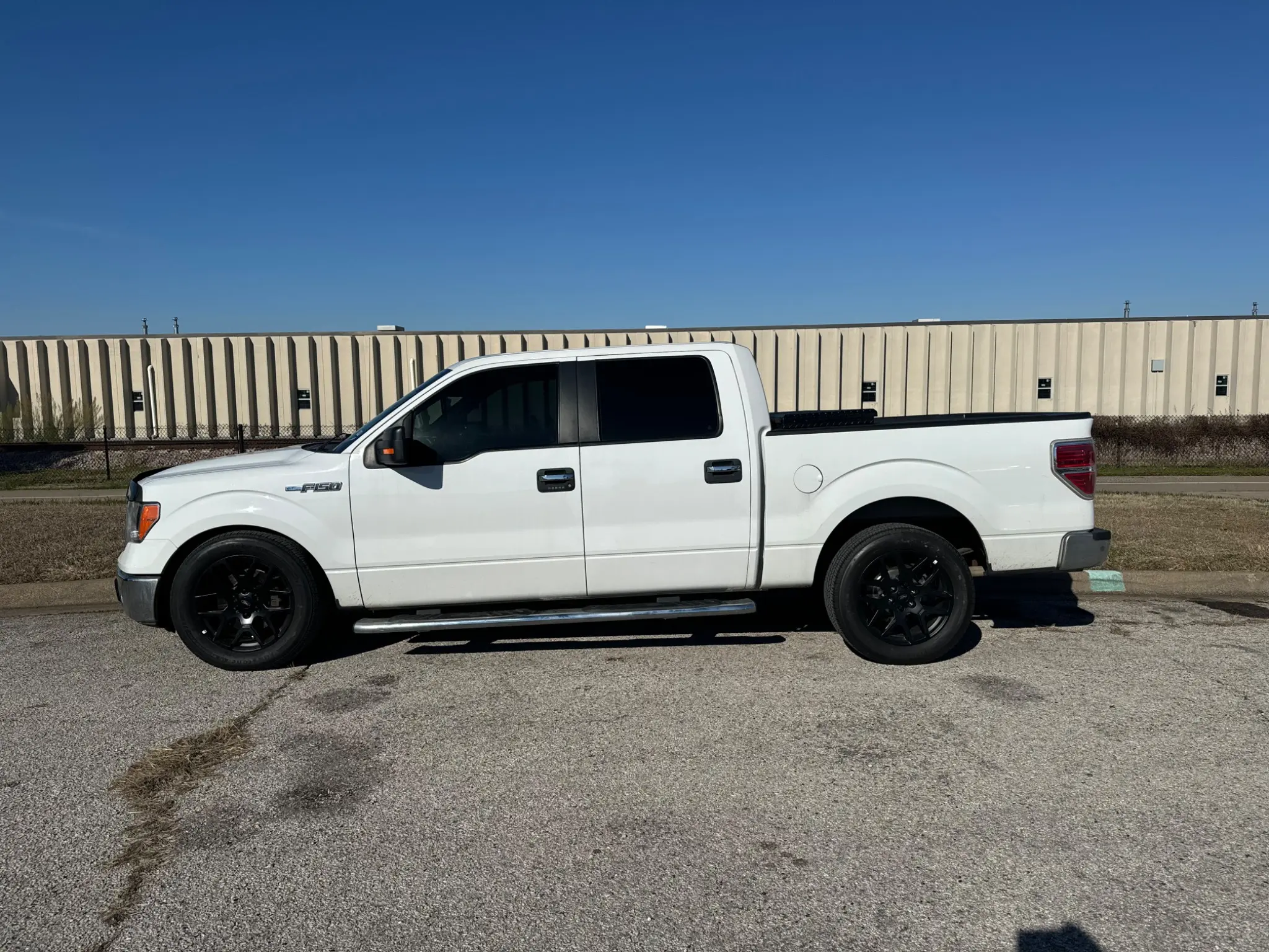 2011 F-150 shop truck side profile in sunlight